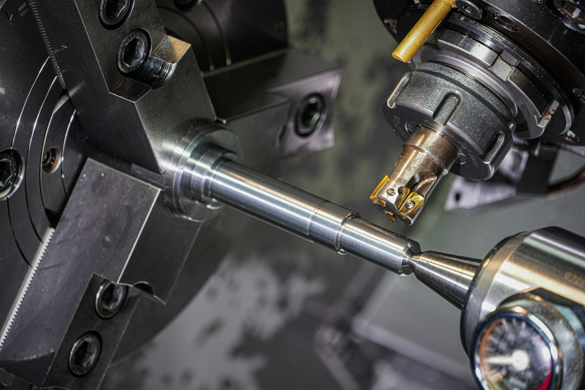 Metal rod being turned on a lathe